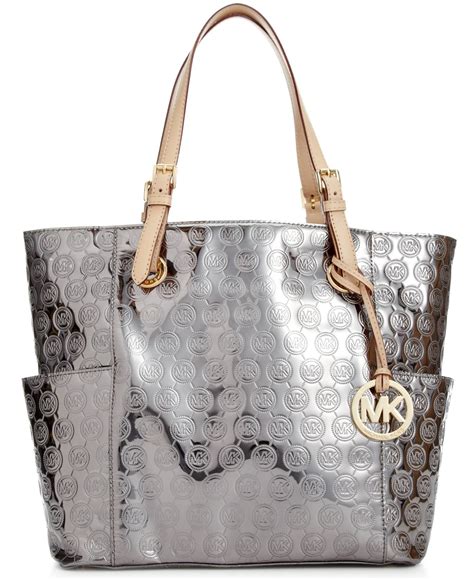 silver michael kors tote|michael kors silver backpack.